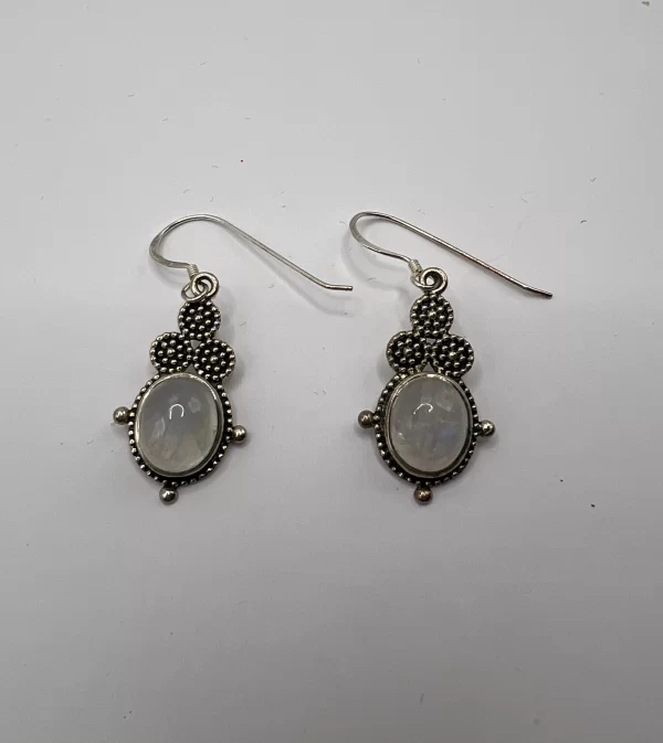 front view milky white moonstone earrings